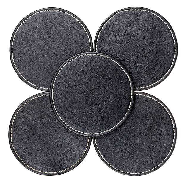 Round black leather table coasters isolated on white